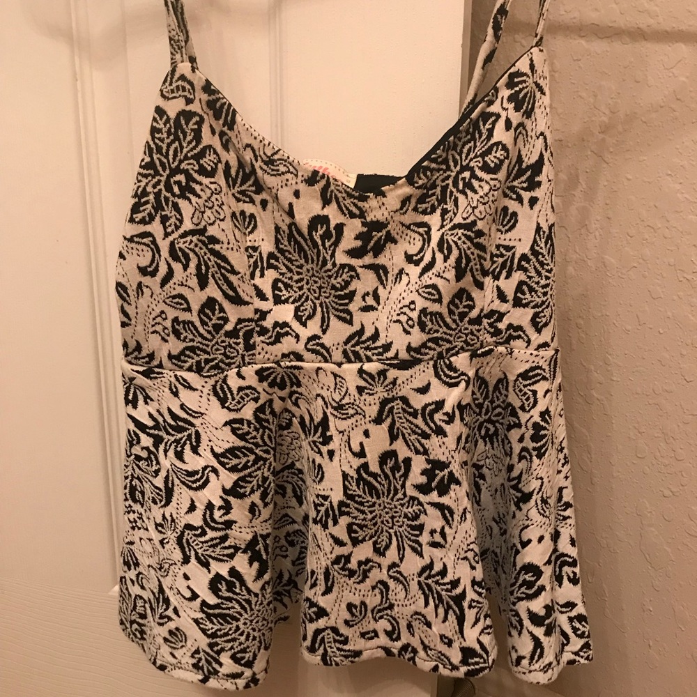 Cream and black peplum top